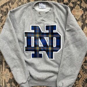 Champion Gray Notre Dame Sweatshirt with Blue Plaid Logo